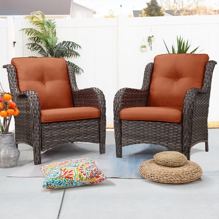Cozy small patio with a wicker conversation set and warm cushions